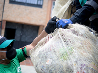 A worker loads the recycled material into the truck during a working day in the town of San Cristóbal, in Bogota, Colombia on September 9, 2...