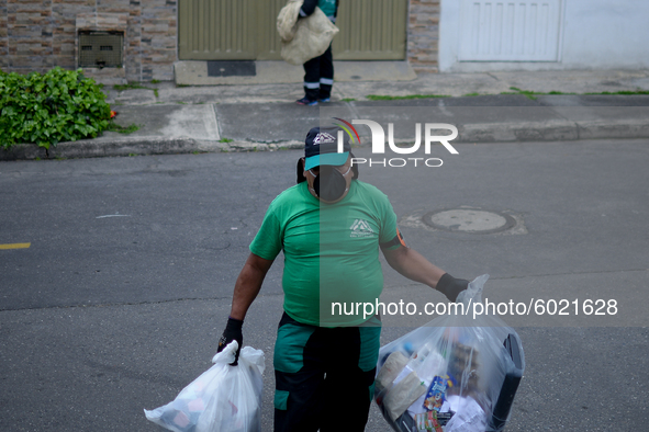 Mr. Botache belongs to the group of Environmental Recuperators walks through the streets of the town of San Cristobal on a collection day in...