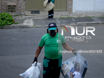 Mr. Botache belongs to the group of Environmental Recuperators walks through the streets of the town of San Cristobal on a collection day in...