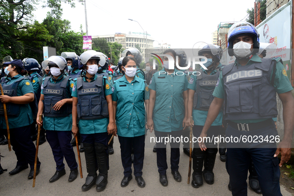 Police Stand guard during activists of Bangladesh Sadharan Chhatra Odhikar Sangrakkhan Parishad staged a demonstration protesting ''false ca...