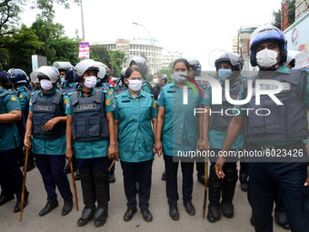 Police Stand guard during activists of Bangladesh Sadharan Chhatra Odhikar Sangrakkhan Parishad staged a demonstration protesting ''false ca...