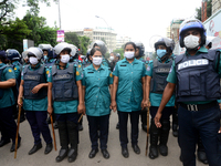 Police Stand guard during activists of Bangladesh Sadharan Chhatra Odhikar Sangrakkhan Parishad staged a demonstration protesting ''false ca...