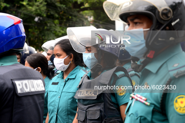 Police Stand guard during activists of Bangladesh Sadharan Chhatra Odhikar Sangrakkhan Parishad staged a demonstration protesting ''false ca...