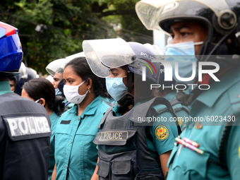 Police Stand guard during activists of Bangladesh Sadharan Chhatra Odhikar Sangrakkhan Parishad staged a demonstration protesting ''false ca...