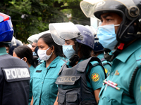 Police Stand guard during activists of Bangladesh Sadharan Chhatra Odhikar Sangrakkhan Parishad staged a demonstration protesting ''false ca...