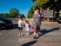 The mother with her children on their way to school, on the first day of school in Molfetta on 24 September 2020.
The return to school for...