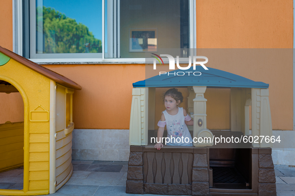 A little girl playing inside the kindergarten on the first day of school in Molfetta on 24 September 2020.
The return to school for childre...