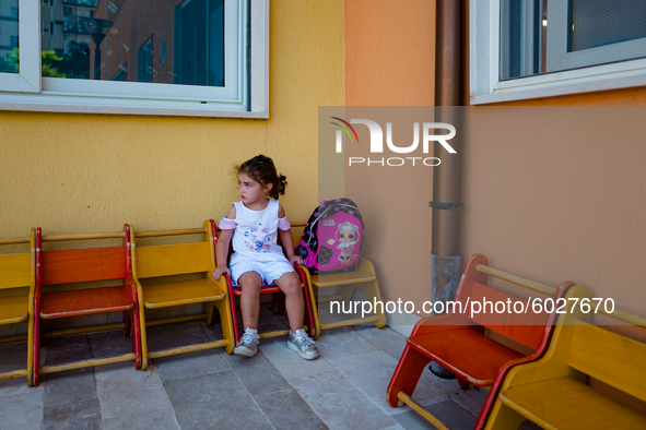 A little girl waiting outside the kindergarten on the first day of school in Molfetta on 24 September 2020.
The return to school for childr...