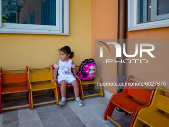 A little girl waiting outside the kindergarten on the first day of school in Molfetta on 24 September 2020.
The return to school for childr...