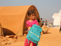 Syrian students play in front of their school tent on the first day of the new school year near the city of Maarat Misreen in Idlib countrys...