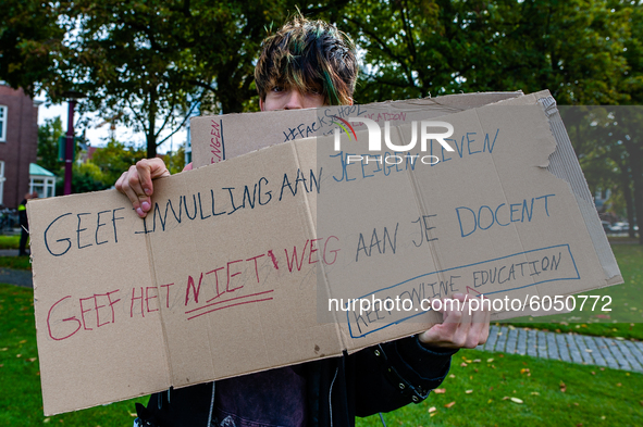 A man is holding a placard, during the students protest for more physical attendance classes, in Amsterdam, Netherlands on October 2nd, 2020...