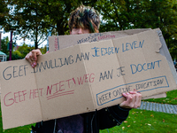 A man is holding a placard, during the students protest for more physical attendance classes, in Amsterdam, Netherlands on October 2nd, 2020...