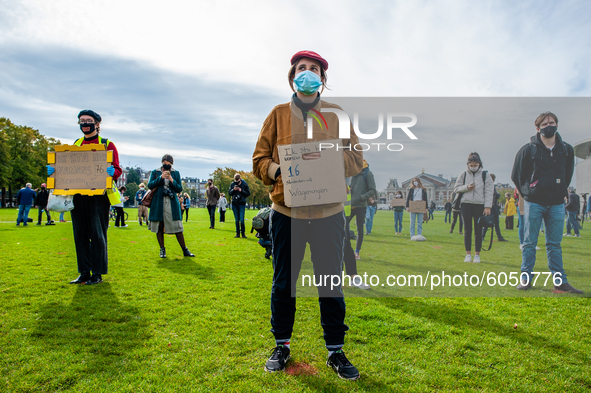 Several students are holding placards in representation of other students during the students protest for more physical attendance classes,...