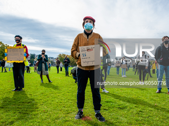 Several students are holding placards in representation of other students during the students protest for more physical attendance classes,...