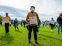 Several students are holding placards in representation of other students during the students protest for more physical attendance classes,...