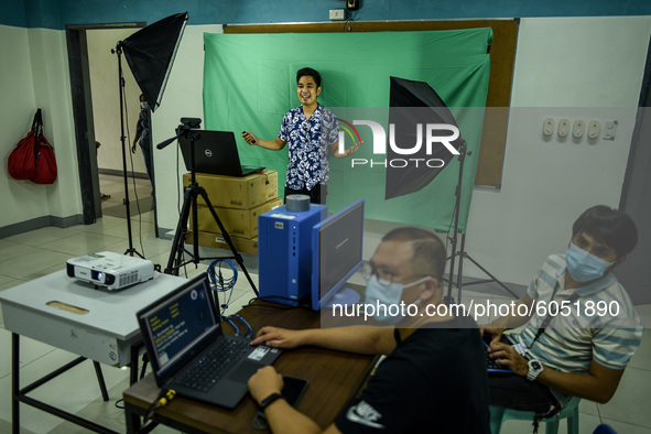 Teachers make use of green screen in filming lectures in preparation for the opening of classes at a school in Valenzuela City in Metro Mani...