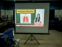 A class lecture is projected on a screen as teachers prepare for the opening of classes at a school in Valenzuela City in Metro Manila, Phil...