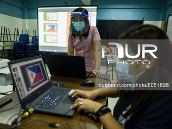 Teachers prepare online lectures for the opening of classes at a school in Valenzuela City in Metro Manila, Philippines on October 2, 2020....