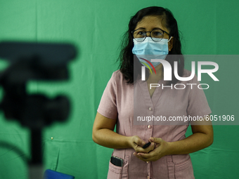 A teacher makes use of green screen in filming lectures in preparation for the opening of classes at a school in Valenzuela City in Metro Ma...