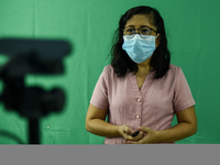 A teacher makes use of green screen in filming lectures in preparation for the opening of classes at a school in Valenzuela City in Metro Ma...