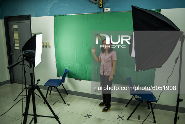 A teacher makes use of green screen in filming lectures in preparation for the opening of classes at a school in Valenzuela City in Metro Ma...