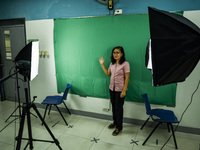 A teacher makes use of green screen in filming lectures in preparation for the opening of classes at a school in Valenzuela City in Metro Ma...