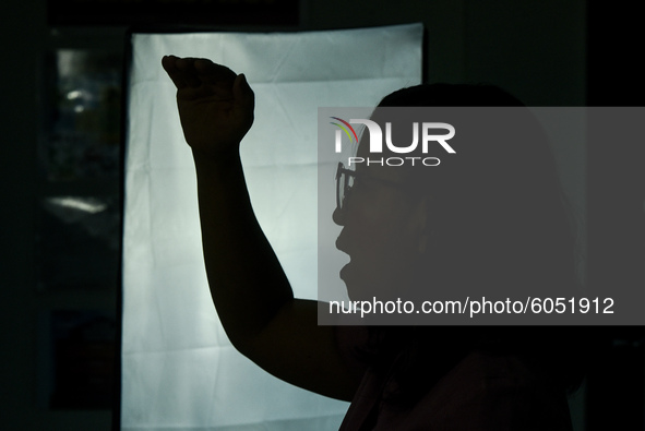 A teacher films online lectures in preparation for the opening of classes at a school in Valenzuela City in Metro Manila, Philippines on Oct...