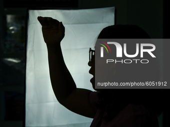 A teacher films online lectures in preparation for the opening of classes at a school in Valenzuela City in Metro Manila, Philippines on Oct...