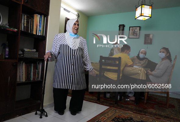 Palestinian teacher Ekram el-astal, 80, teaches her neighbours' students an Maths language lesson as schools are shut due to the coronavirus...