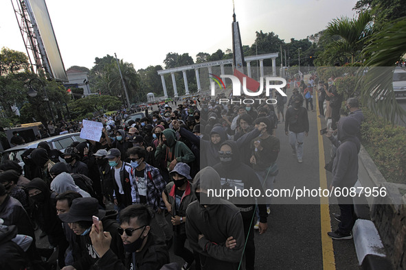 Indonesian student shout a slogan during a demonstration against a new Indonesian labour law passed last week, in Bogor, West Java, October...