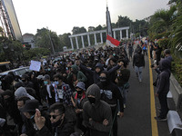 Indonesian student shout a slogan during a demonstration against a new Indonesian labour law passed last week, in Bogor, West Java, October...