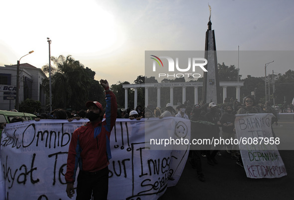 Indonesian student shout a slogan during a demonstration against a new Indonesian labour law passed last week, in Bogor, West Java, October...