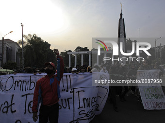 Indonesian student shout a slogan during a demonstration against a new Indonesian labour law passed last week, in Bogor, West Java, October...