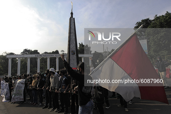 Indonesian student shout a slogan during a demonstration against a new Indonesian labour law passed last week, in Bogor, West Java, October...