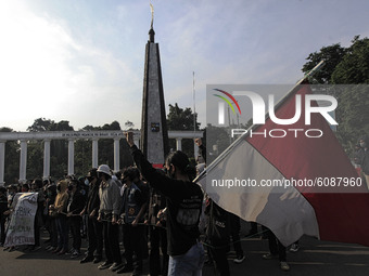 Indonesian student shout a slogan during a demonstration against a new Indonesian labour law passed last week, in Bogor, West Java, October...