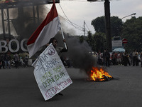 A Indonesian student shout a slogan during a demonstration against a new Indonesian labour law passed last week, in Bogor, West Java, Octobe...