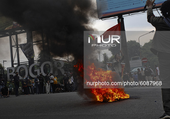 A Indonesian student shout a slogan during a demonstration against a new Indonesian labour law passed last week, in Bogor, West Java, Octobe...