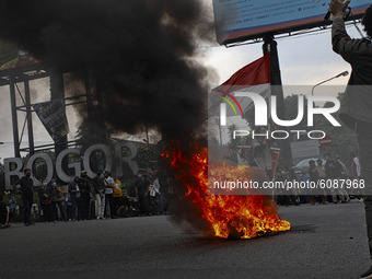 A Indonesian student shout a slogan during a demonstration against a new Indonesian labour law passed last week, in Bogor, West Java, Octobe...