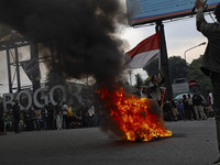 A Indonesian student shout a slogan during a demonstration against a new Indonesian labour law passed last week, in Bogor, West Java, Octobe...