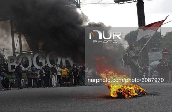 A Indonesian student shout a slogan during a demonstration against a new Indonesian labour law passed last week, in Bogor, West Java, Octobe...