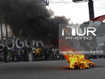 A Indonesian student shout a slogan during a demonstration against a new Indonesian labour law passed last week, in Bogor, West Java, Octobe...