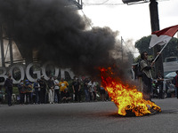 A Indonesian student shout a slogan during a demonstration against a new Indonesian labour law passed last week, in Bogor, West Java, Octobe...