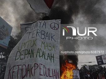 A Indonesian student shout a slogan during a demonstration against a new Indonesian labour law passed last week, in Bogor, West Java, Octobe...