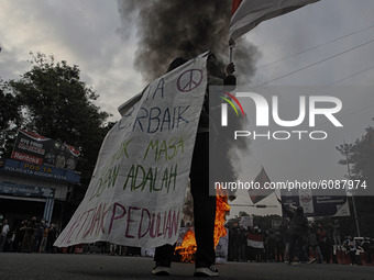 A Indonesian student shout a slogan during a demonstration against a new Indonesian labour law passed last week, in Bogor, West Java, Octobe...