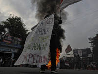 A Indonesian student shout a slogan during a demonstration against a new Indonesian labour law passed last week, in Bogor, West Java, Octobe...