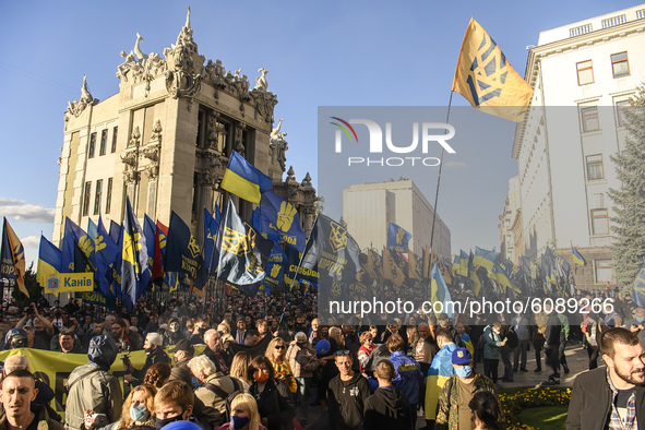 Veterans, activists and supporters of Ukraine's nationalist movements take part in a procession to mark the Defender of Ukraine Day and the...