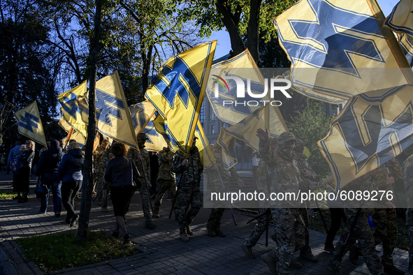 Veterans, activists and supporters of Ukraine's nationalist movements take part in a procession to mark the Defender of Ukraine Day and the...