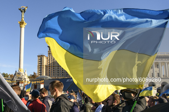 Veterans, activists and supporters of Ukraine's nationalist movements take part in a procession to mark the Defender of Ukraine Day and the...