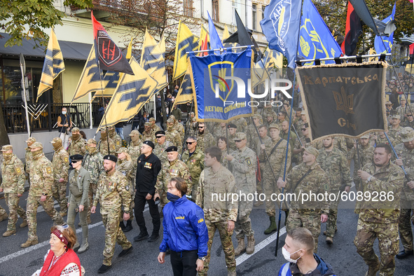 Veterans, activists and supporters of Ukraine's nationalist movements take part in a procession to mark the Defender of Ukraine Day and the...