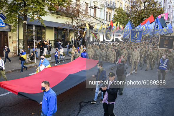 Veterans, activists and supporters of Ukraine's nationalist movements take part in a procession to mark the Defender of Ukraine Day and the...